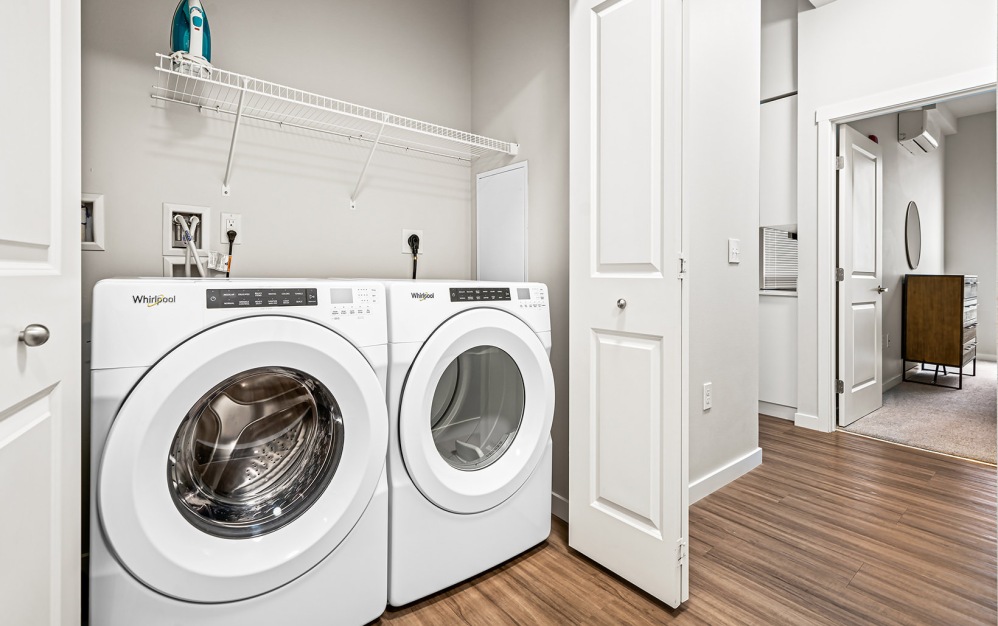 side-by-side washer/dryers in laundry closet